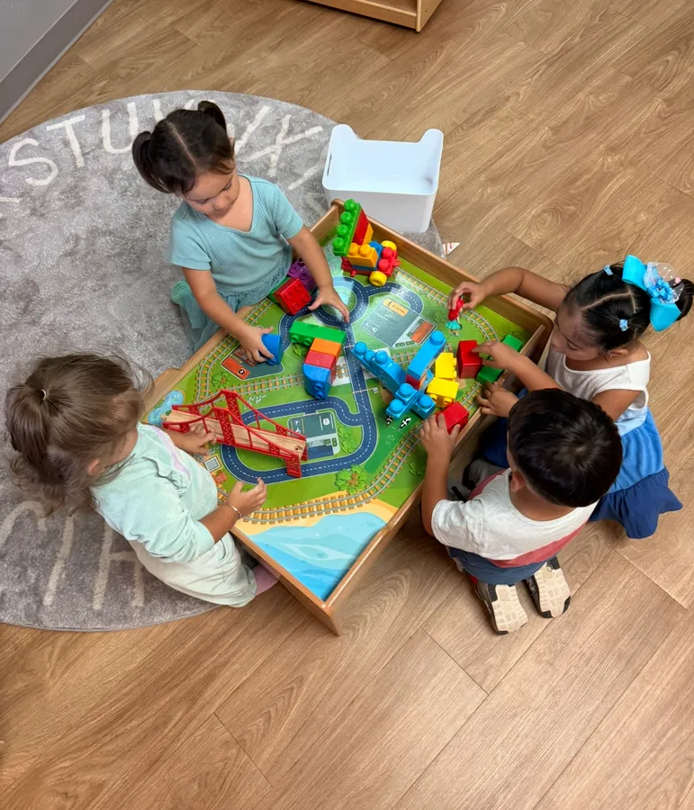 Children playing together with building blocks